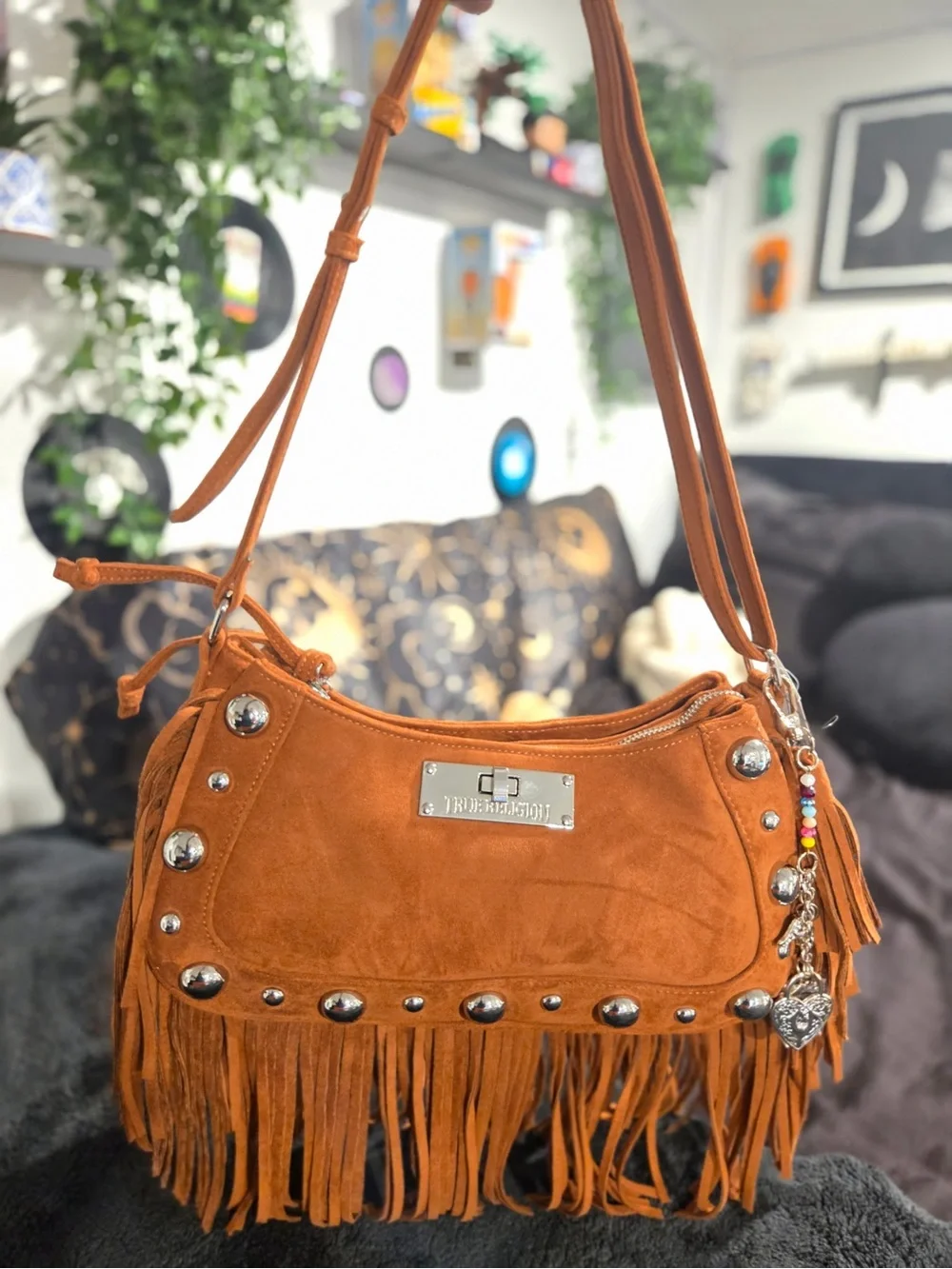 True Religion Faux suede fringe purse with silver studs and a heart charm